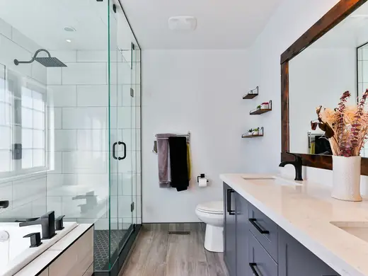 Modern bathroom with a glass shower and white vanity